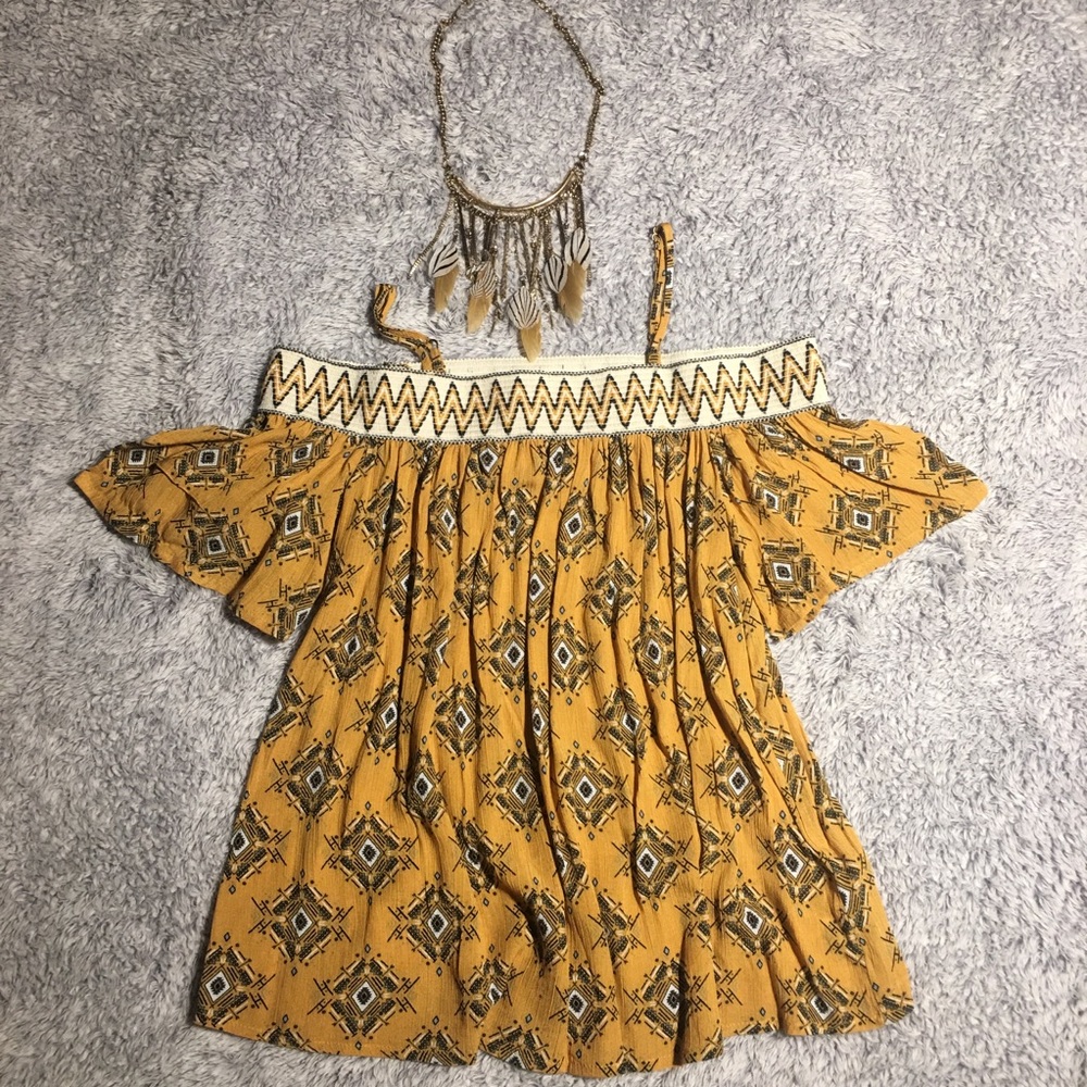 off the shoulder shirt with necklace